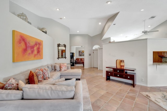 living room featuring ceiling fan, high vaulted ceiling, and a textured ceiling