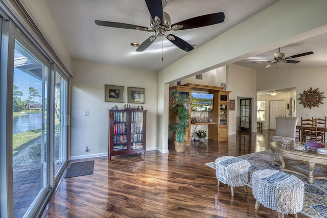 6938 Touchstone Cir, Palm Beach Gardens, FL 33418 - living room with a ceiling fan, wood finished floors, baseboards, and a textured ceiling