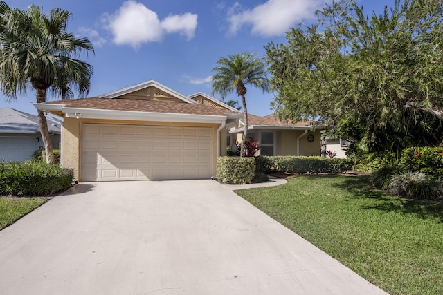 ranch-style home with a garage and a front yard