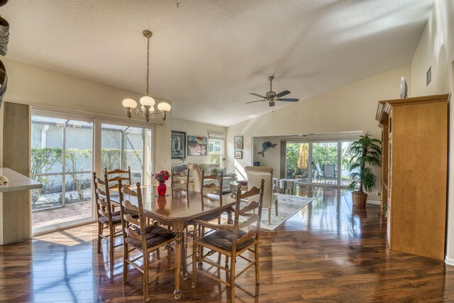 living room with vaulted ceiling, dark wood-type flooring, a textured ceiling, and ceiling fan