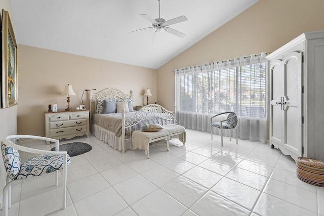 tiled bedroom with ceiling fan and lofted ceiling