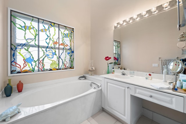 bathroom featuring vanity, a bathtub, and plenty of natural light