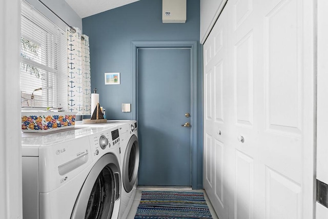 laundry area with washing machine and dryer