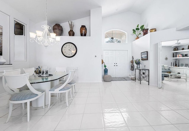 tiled dining area with a notable chandelier and high vaulted ceiling