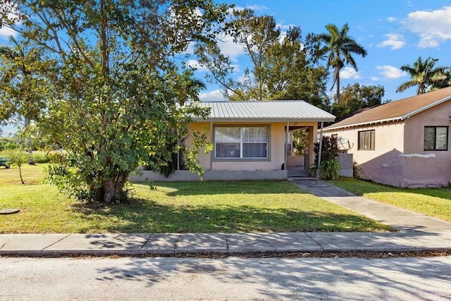 view of front of home with a front lawn