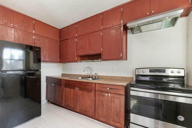 kitchen featuring electric stove, sink, extractor fan, a textured ceiling, and black fridge