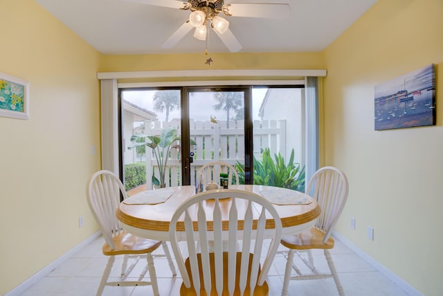 dining room featuring a wealth of natural light, ceiling fan, and light tile patterned floors