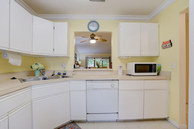 kitchen with crown molding, sink, white appliances, and white cabinets