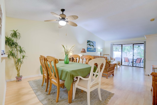 dining space with lofted ceiling, light hardwood / wood-style flooring, and ceiling fan