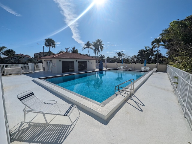 view of swimming pool featuring a patio area