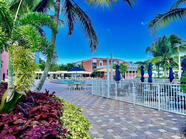 view of home's community with a patio area