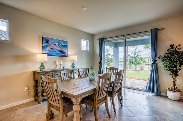 dining area with light tile patterned floors