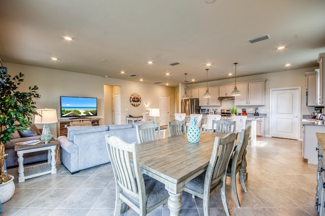 dining area with light tile patterned flooring