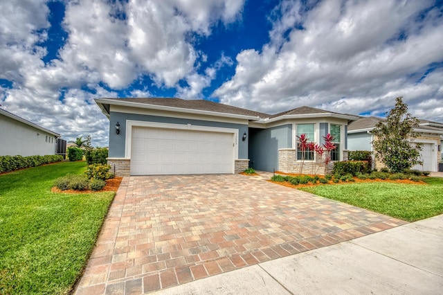 view of front of property with a garage and a front yard