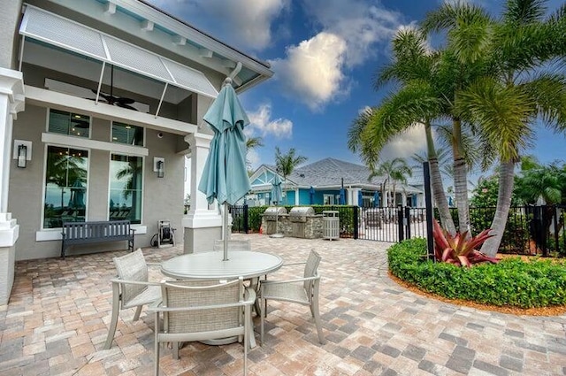 view of patio featuring ceiling fan