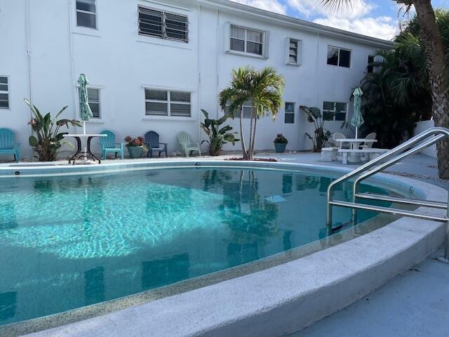 view of swimming pool with a patio area