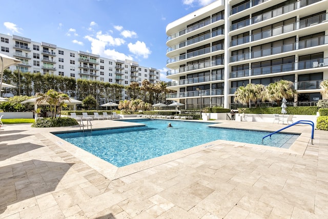 view of swimming pool featuring a patio area