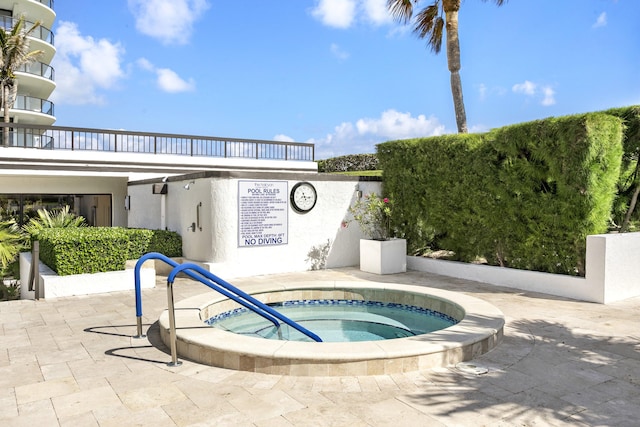 view of pool featuring a community hot tub