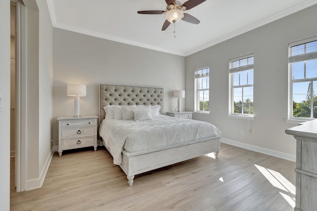 bedroom featuring crown molding, ceiling fan, and light hardwood / wood-style floors