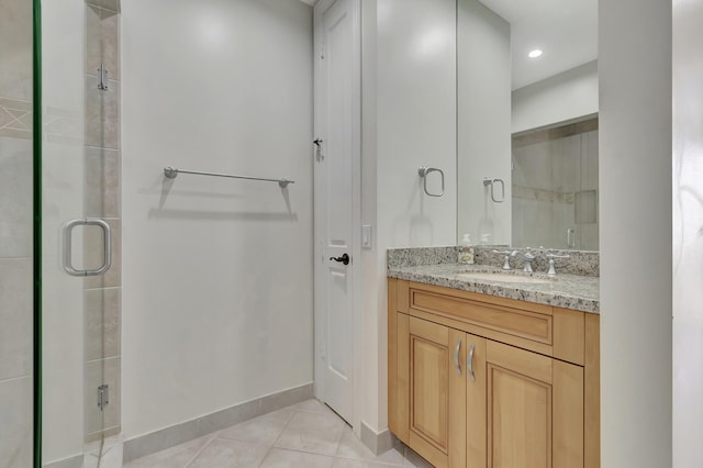 bathroom with vanity, tile patterned floors, and walk in shower