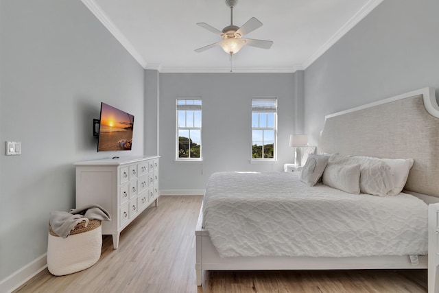 bedroom featuring crown molding, ceiling fan, and light wood-type flooring