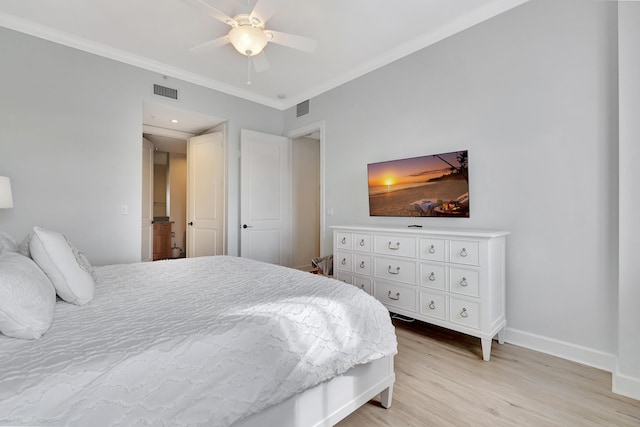 bedroom featuring crown molding, ceiling fan, and light hardwood / wood-style floors