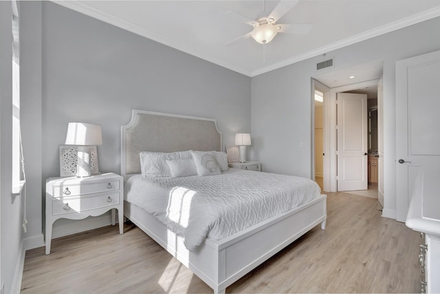 bedroom with ornamental molding, ceiling fan, and light wood-type flooring