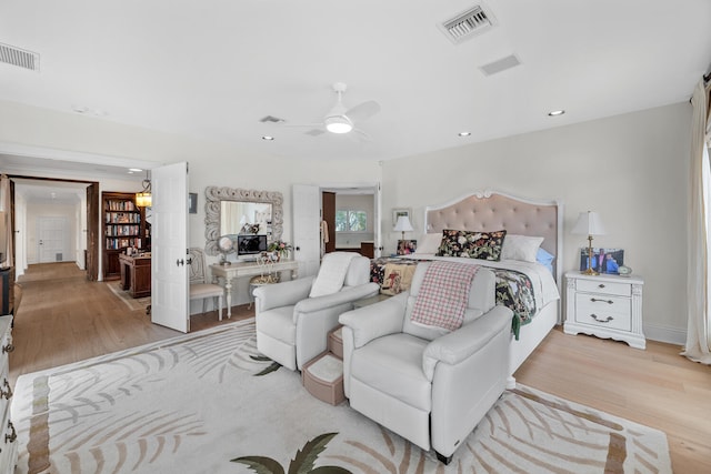 bedroom featuring light hardwood / wood-style flooring and ceiling fan