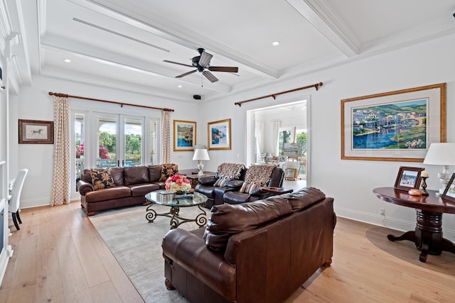 living room with ceiling fan, ornamental molding, light hardwood / wood-style floors, french doors, and beamed ceiling