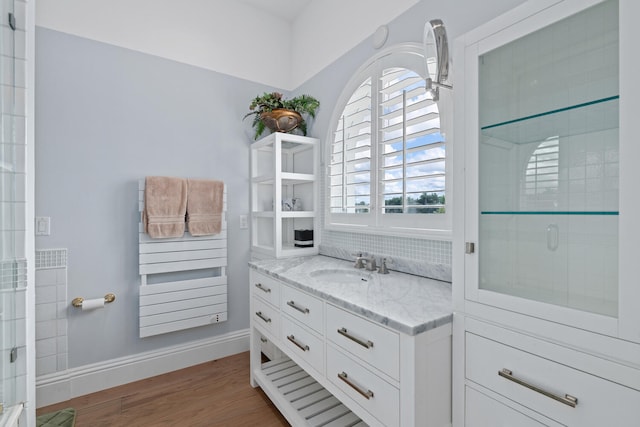 walk in closet with dark hardwood / wood-style floors and sink