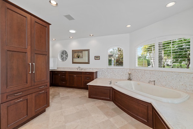 bathroom featuring a bathing tub and vanity