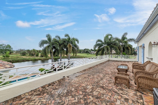 view of patio / terrace with a water view