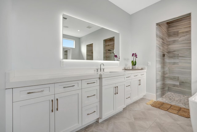 bathroom featuring vanity, parquet floors, and a shower