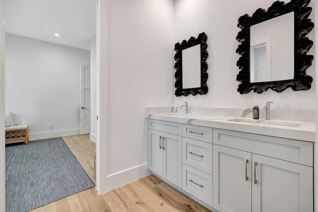 bathroom featuring hardwood / wood-style flooring and vanity