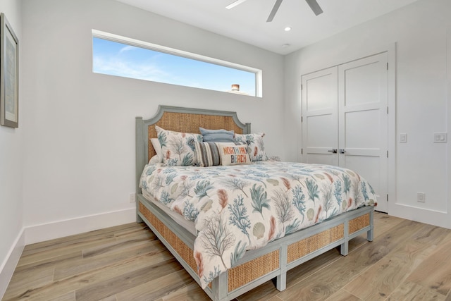 bedroom with ceiling fan and light wood-type flooring