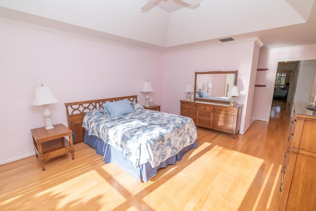 bedroom with crown molding, wood-type flooring, and ceiling fan