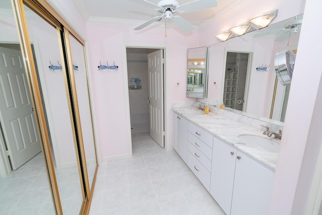 bathroom with vanity, tile patterned flooring, crown molding, and ceiling fan