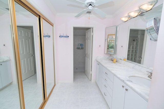 bathroom featuring crown molding, ceiling fan, vanity, and tile patterned flooring