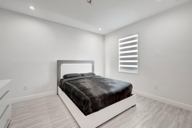 bedroom featuring wood-type flooring