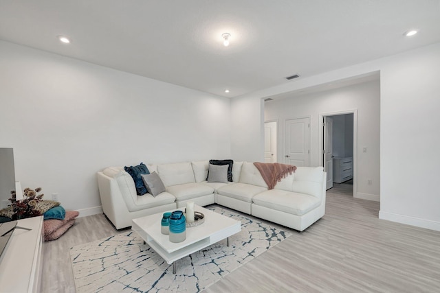 living room with light hardwood / wood-style floors