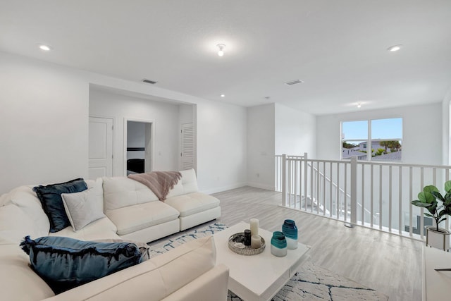 living room with light hardwood / wood-style floors