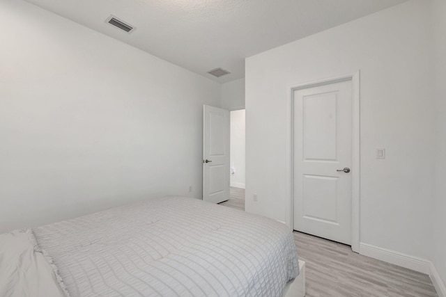 bedroom with light hardwood / wood-style flooring