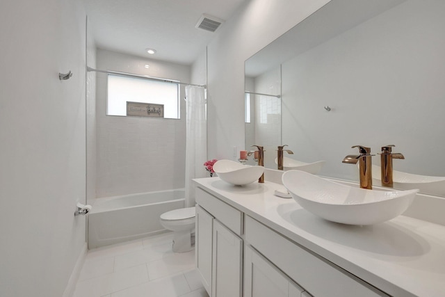 full bathroom featuring shower / tub combo with curtain, vanity, toilet, and tile patterned flooring