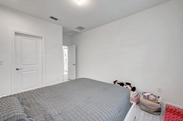 unfurnished bedroom with hardwood / wood-style floors