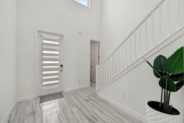 entrance foyer with a towering ceiling