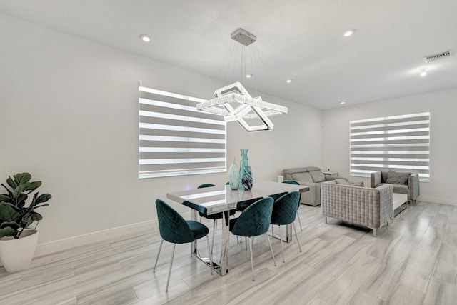 dining area with a notable chandelier