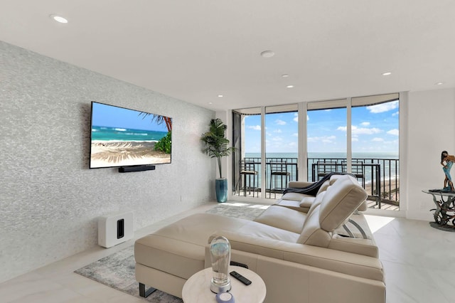 living room featuring floor to ceiling windows