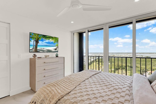 bedroom with access to outside and ceiling fan