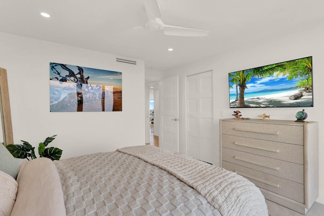 bedroom featuring ceiling fan and a closet