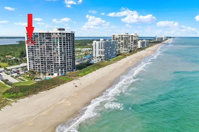 drone / aerial view with a view of the beach and a water view